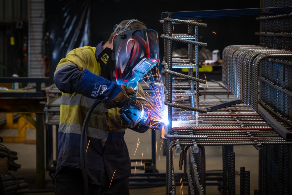 Welder working on steel reinforcing